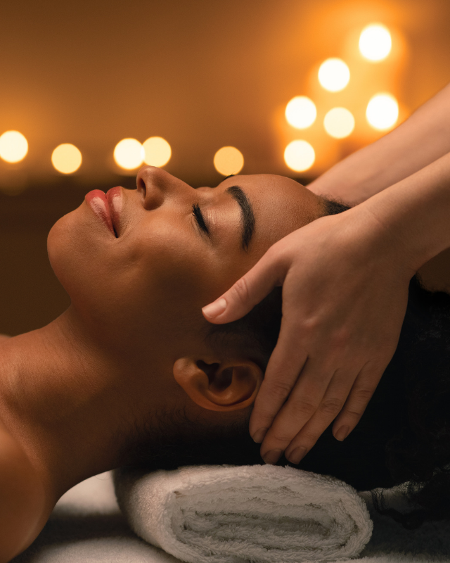 an image of a woman receiving a head massage